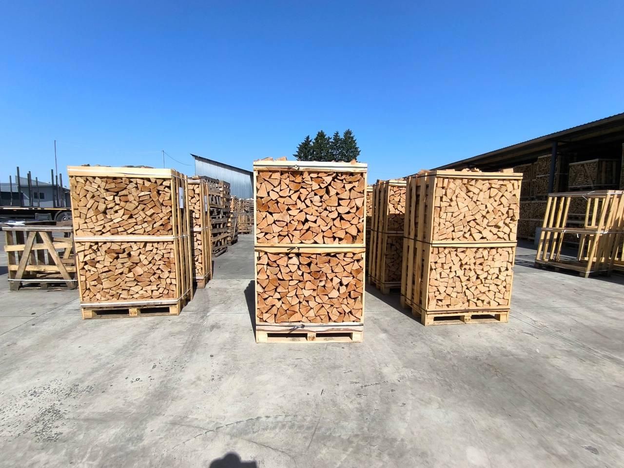 Crates of kiln-dried hardwood firewood on a loading yard